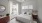 a bedroom with a fan and a bed