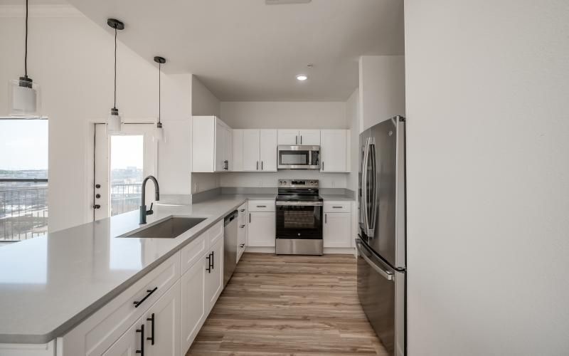 a kitchen with white cabinets