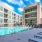 a swimming pool in a courtyard between buildings