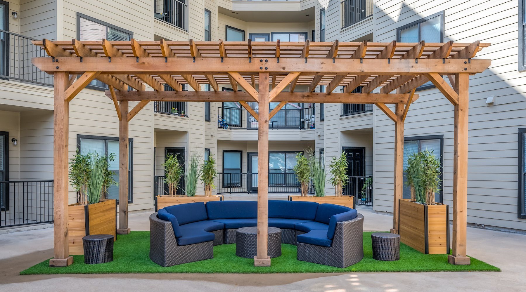 Cutting-edge amenities at your fingertips a covered sitting area with a blue sofa