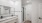 bathroom with double vanity sinks and stand up glass shower
