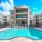 a pool in a courtyard between buildings