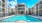 a pool in a courtyard between buildings