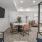 a spacious room with a glass walls and a tv