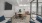 a spacious room with a glass walls and a tv