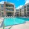 a pool in a courtyard between buildings