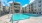 a pool in a courtyard between buildings