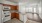 a kitchen with wooden cabinets