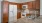 a kitchen with wooden cabinets