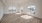 a room with a wood floor and a large window
