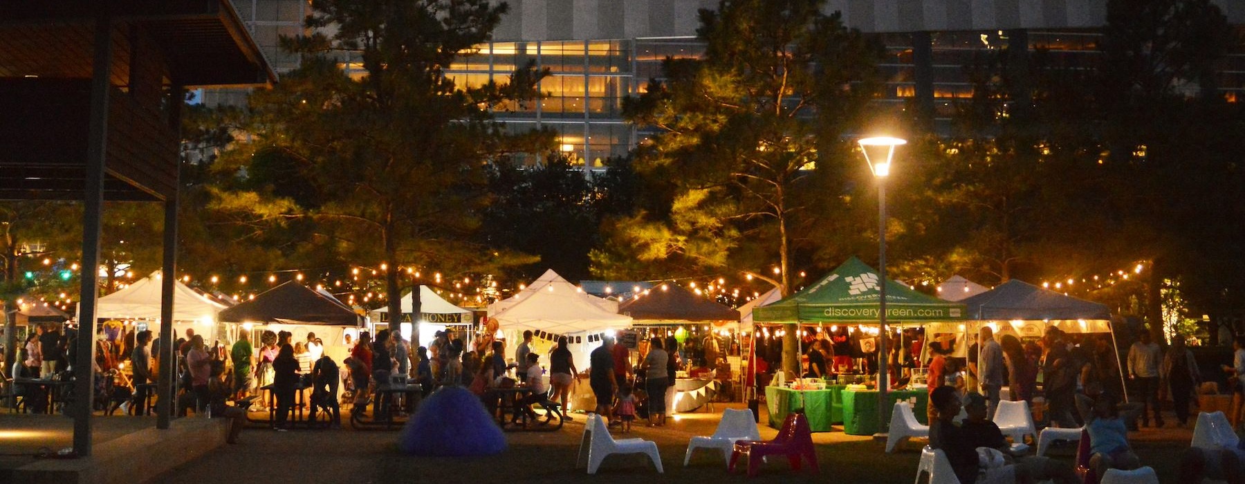 pavillion area at night with lots of people