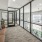 a room with glass walls and a large glass door