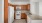 a kitchen with wooden cabinets