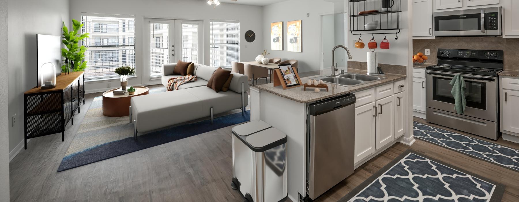 a large kitchen with a couch and a table